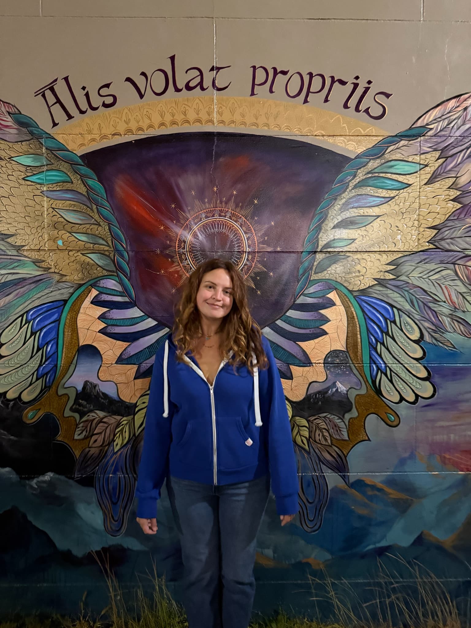 Londynn with the wings mural — out building.
