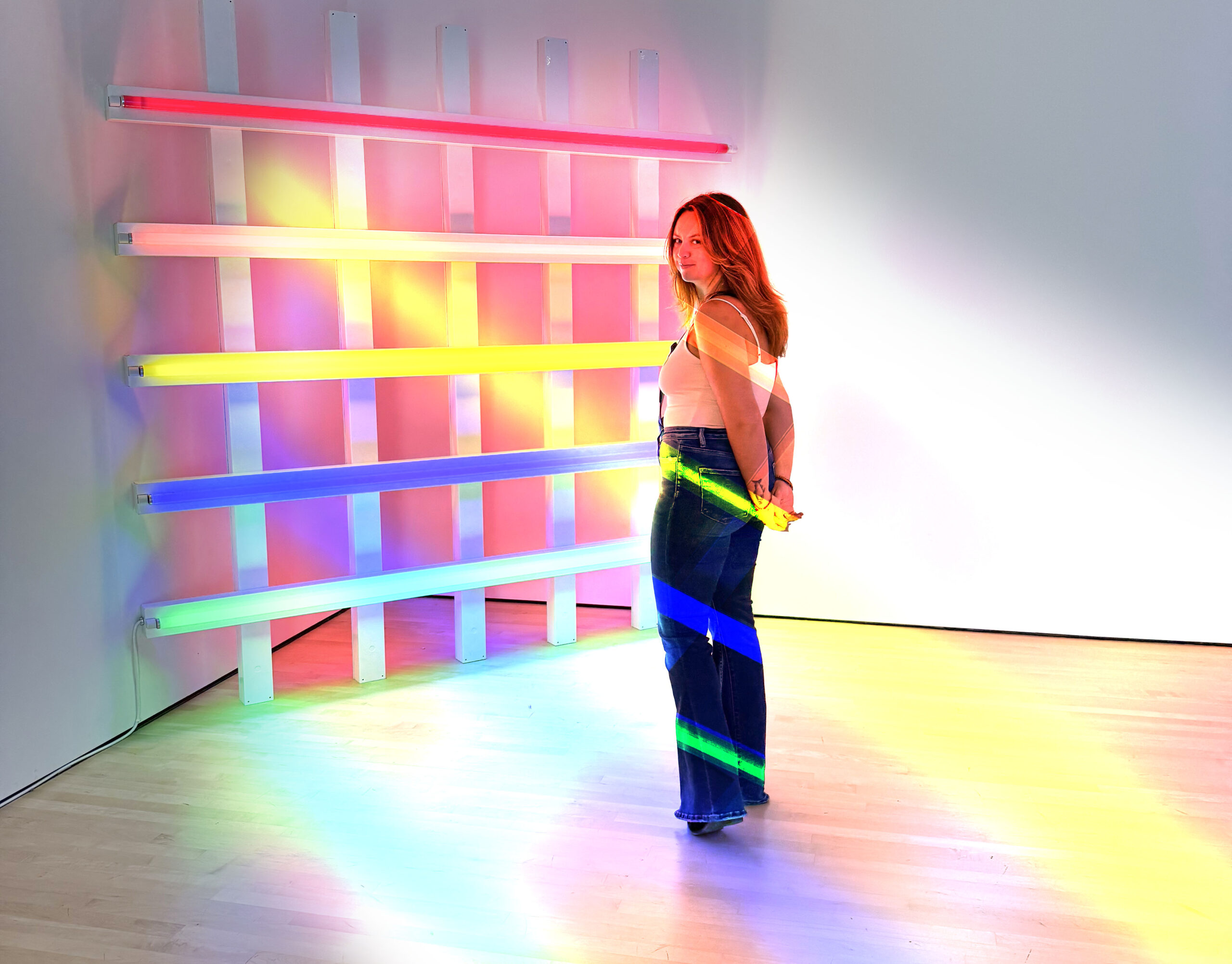Londynn in a rainbow neon-light installation.