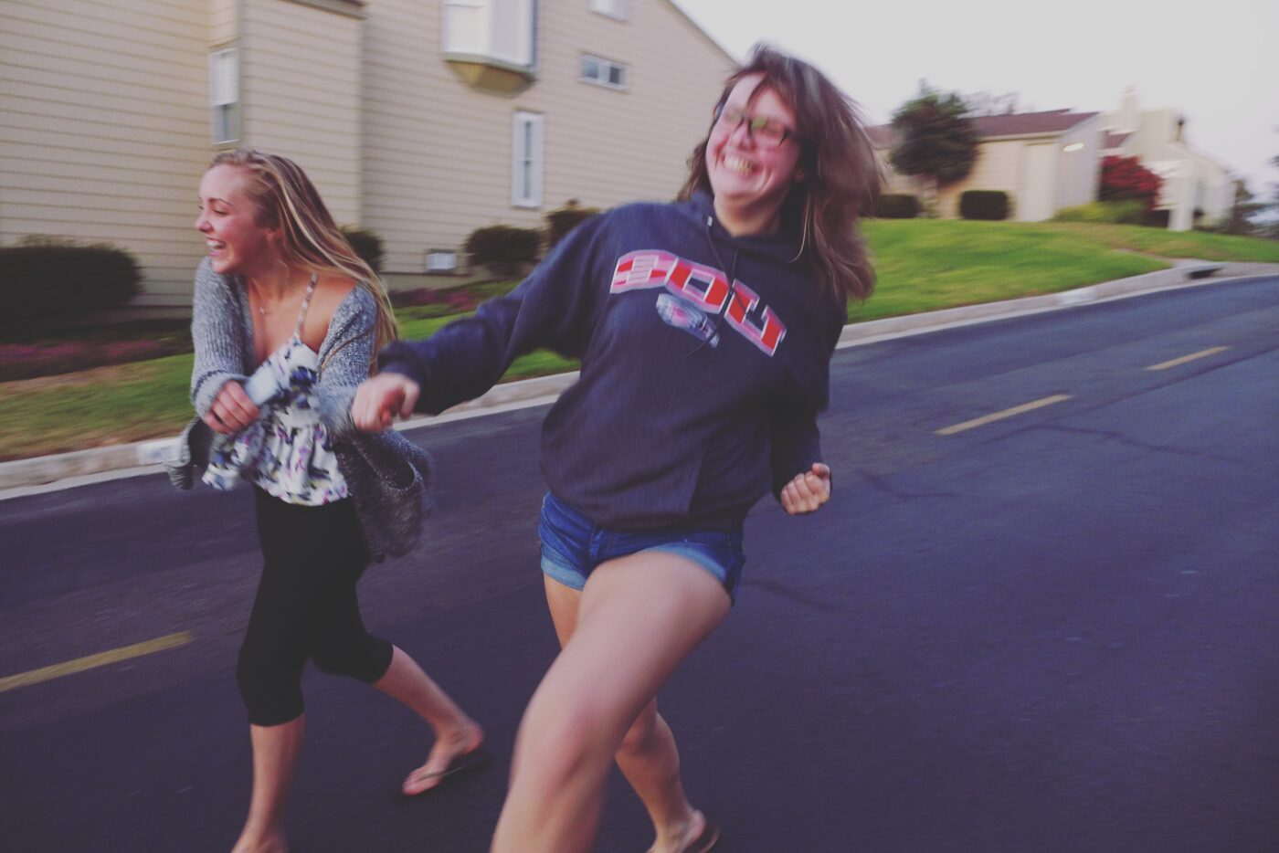 Londynn (right) running with a friend, laughing